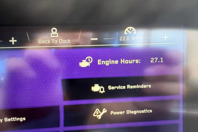 Slide: The Image of 2024 Nautique Super Air Nautique G21 dashboard displaying engine hours and speed. - 5