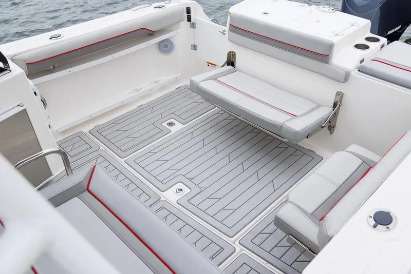 Slide: The Image of Manufacturer Provided Image: 2025 Solara S-250 DC boat interior with gray seating and red accents. - 8