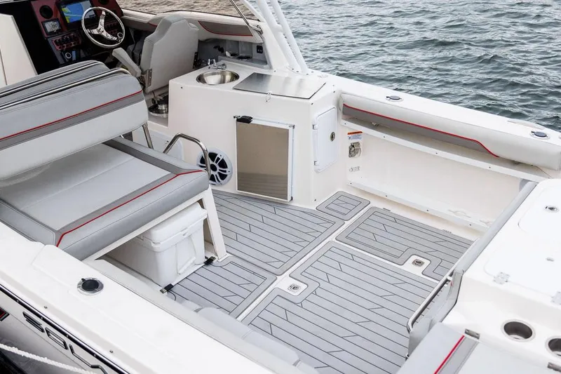 Slide: The Image of Manufacturer Provided Image: 2025 Solara S-250 DC boat interior with sleek seating and modern design on the water. - 9