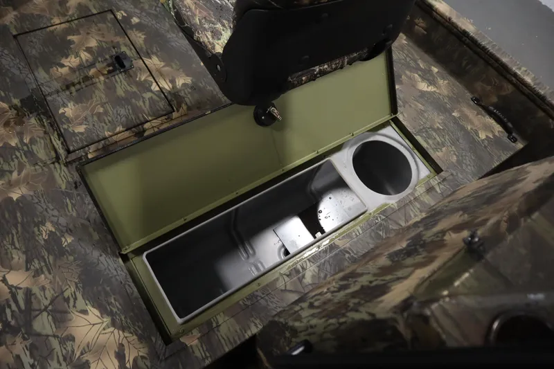Slide: The Image of 2026 Lowe Roughneck RX2070 CC interior storage compartment with camouflage design. - 15