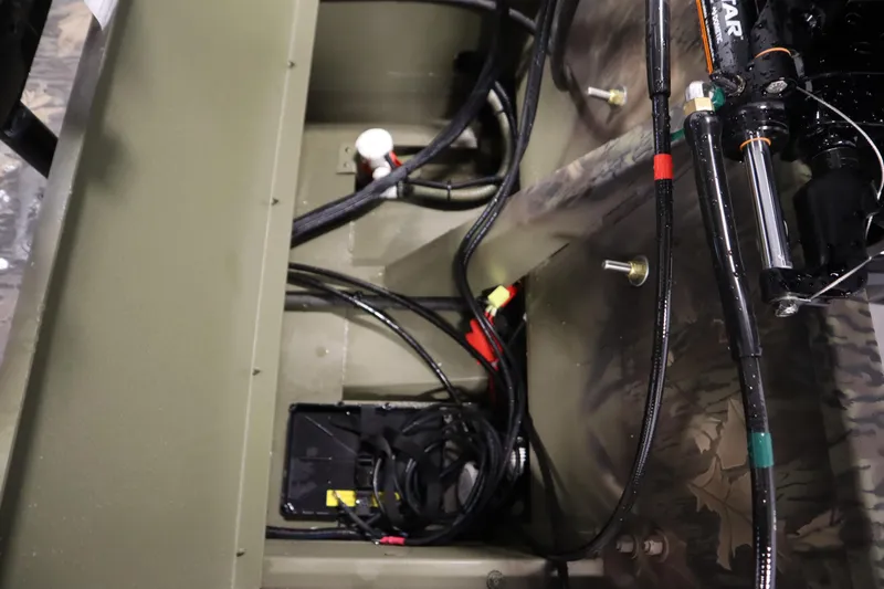 Slide: The Image of 2026 Lowe Roughneck RX2070 CC boat interior wiring and hydraulic system details. - 27