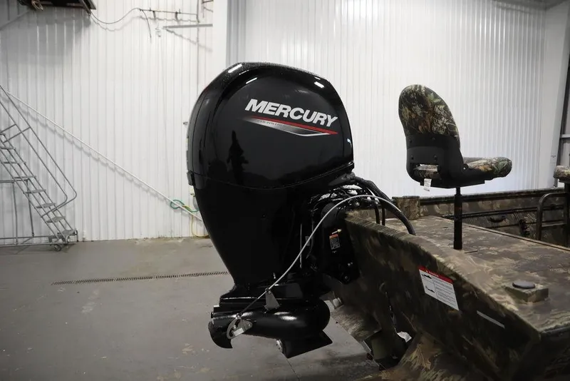 Slide: The Image of 2026 Lowe Roughneck RX2070 CC boat with Mercury outboard motor in a garage setting. - 38