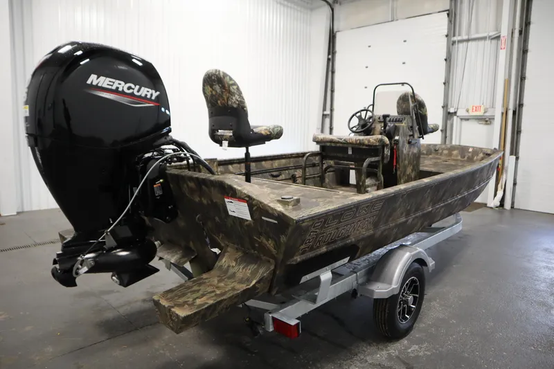 Slide: The Image of 2026 Lowe Roughneck RX2070 CC boat with Mercury engine on trailer in garage. - 4