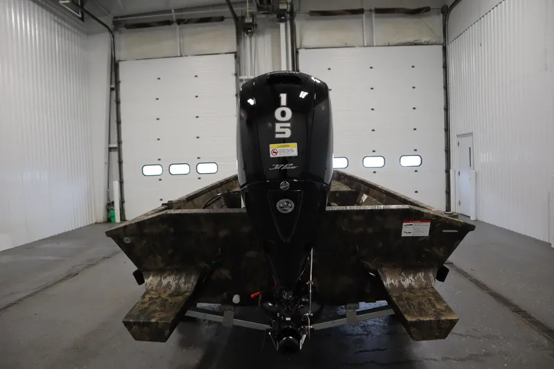 Slide: The Image of 2026 Lowe Roughneck RX2070 CC boat with 105 HP motor in a garage setting. - 5