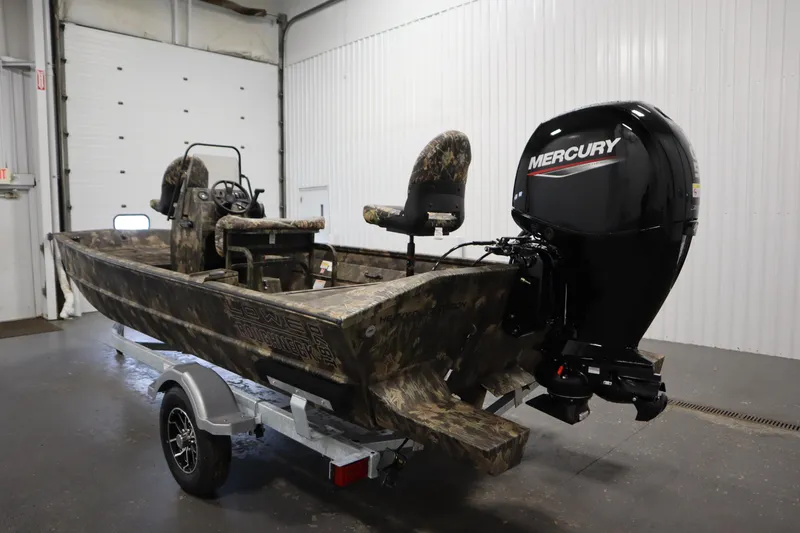 Slide: The Image of 2026 Lowe Roughneck RX2070 CC boat with Mercury outboard motor in a garage. - 6