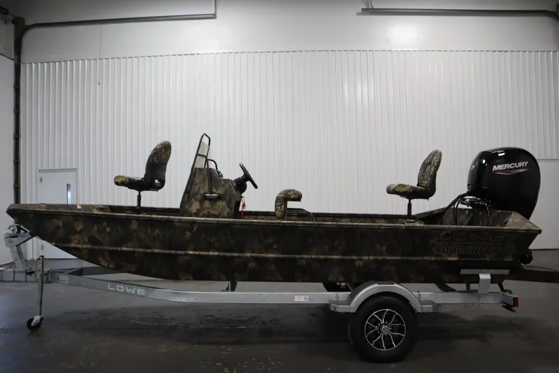 Slide: The Image of 2026 Lowe Roughneck RX2070 CC boat with camo design and Mercury engine on trailer. - 7