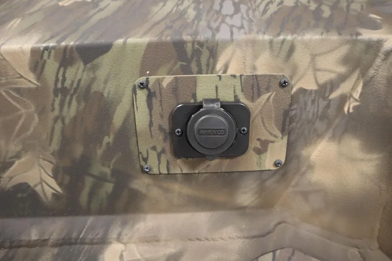 Slide: The Image of Camouflage-patterned panel with a Marinco socket on a 2026 Lowe Roughneck RX1860 Pathfinder. - 10