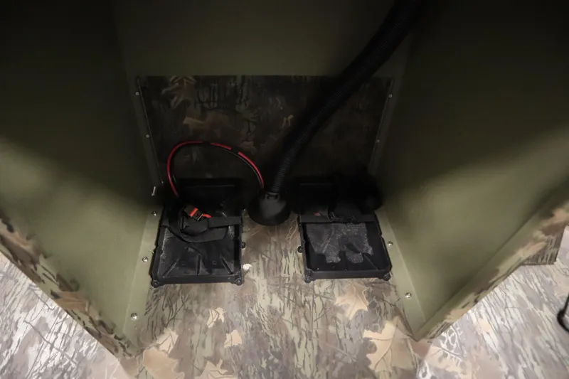 Slide: The Image of Interior view of 2026 Lowe Roughneck RX1860 Pathfinder boat, featuring camo design and wiring components. - 20