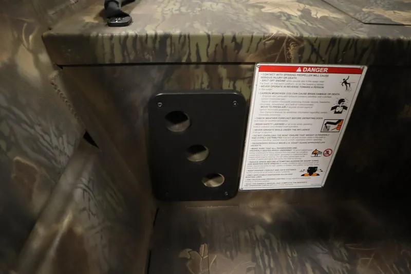 Slide: The Image of Interior of 2026 Lowe Roughneck RX1860 Pathfinder with safety warning label. - 22