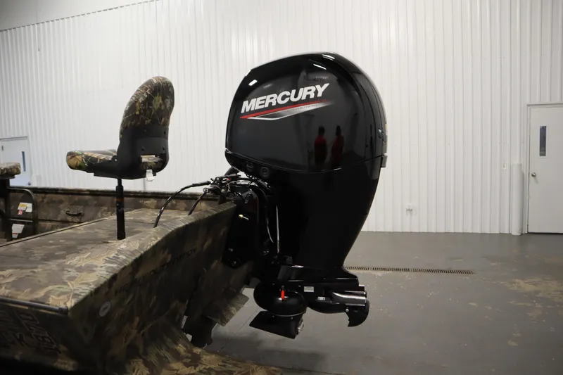 Slide: The Image of 2026 Lowe Roughneck RX1860 Pathfinder with Mercury outboard motor in a showroom. - 29