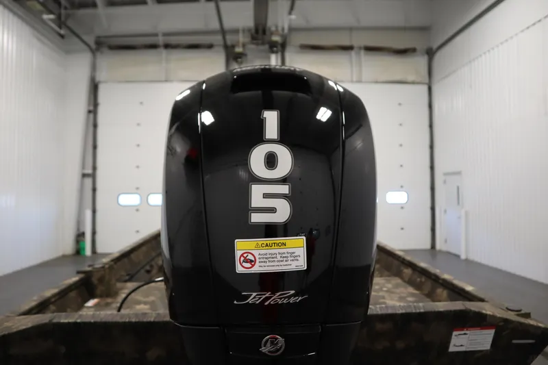 Slide: The Image of 2026 Lowe Roughneck RX1860 Pathfinder with 105 Jet Power engine in a garage. - 31