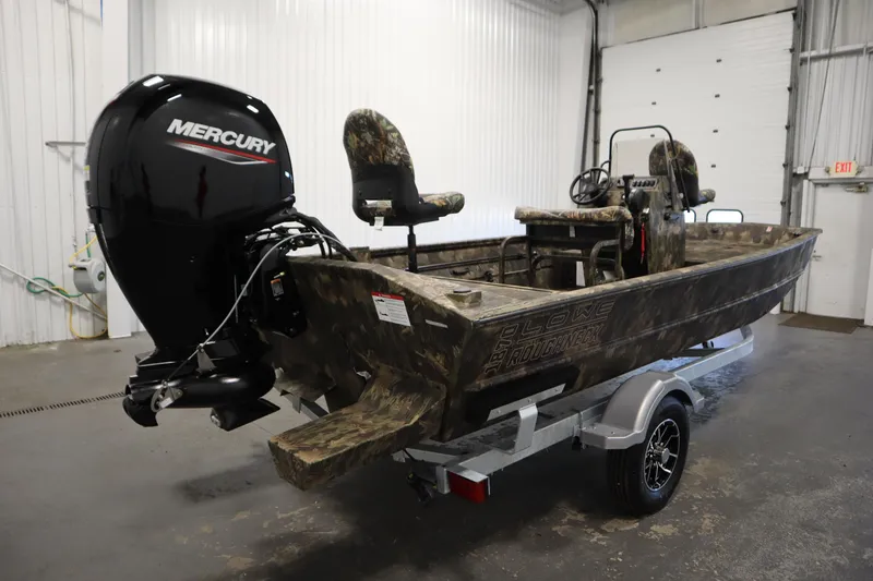 Slide: The Image of 2026 Lowe Roughneck RX1860 Pathfinder boat with Mercury engine in a garage setting. - 4