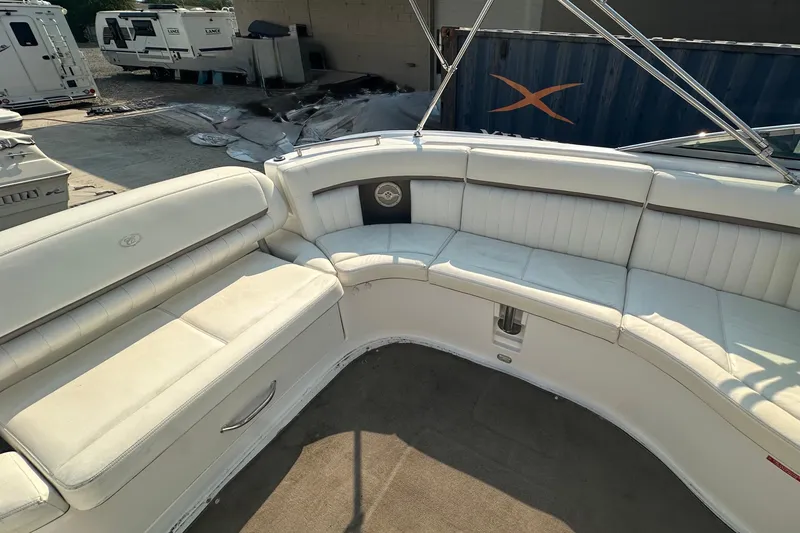 Slide: The Image of 2006 Cobalt 323 boat interior with white leather seating and spacious layout. - 10
