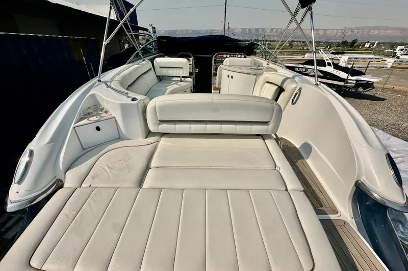 Slide: The Image of 2006 Cobalt 323 boat interior with spacious white seating and sunbathing area. - 13