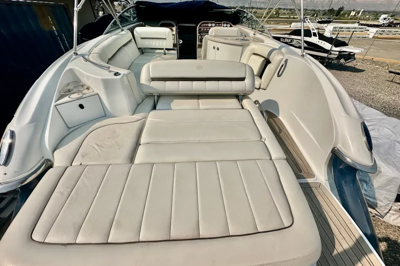 Slide: The Image of 2006 Cobalt 323 boat interior with white leather seating and spacious layout. - 14
