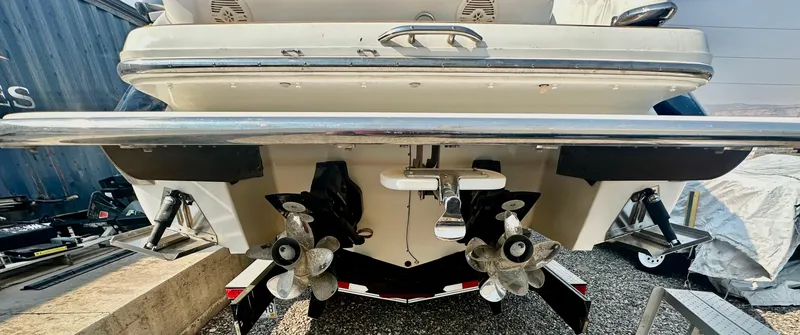 Slide: The Image of Rear view of a 2006 Cobalt 323 boat with dual propellers. - 16