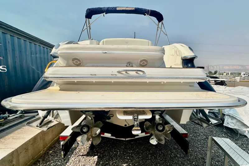 Slide: The Image of Rear view of a 2006 Cobalt 323 boat with dual propellers and swim platform. - 17