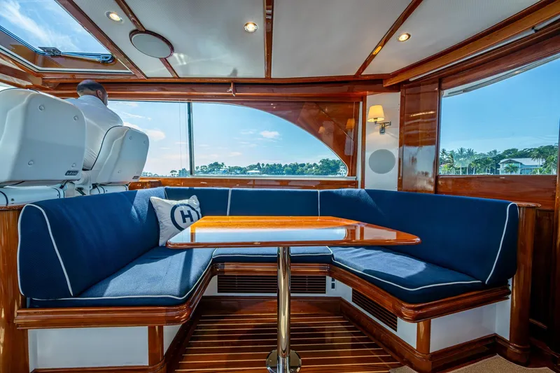 Slide: The Image of Luxurious interior of 2019 Hinckley T55 MKII Motor Yacht with elegant seating and wooden finishes. - 13