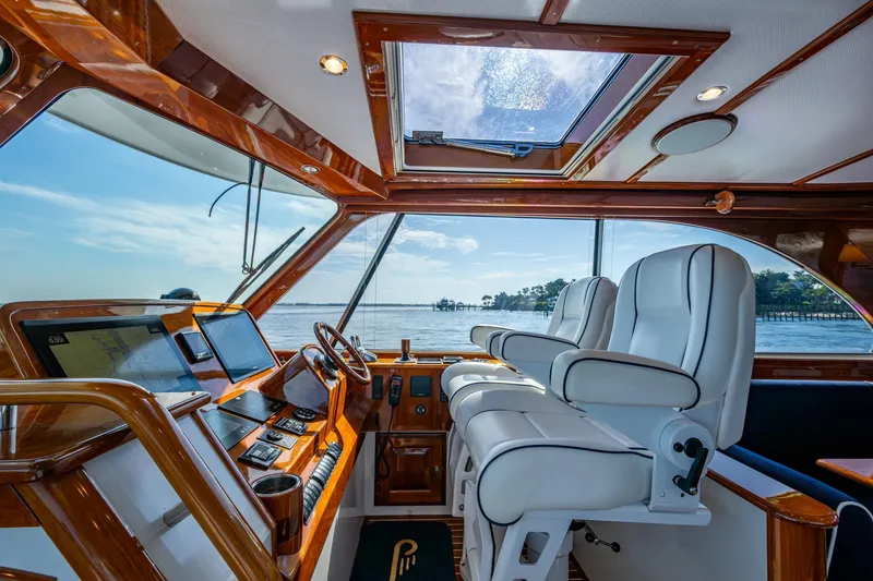 Slide: The Image of Interior of 2019 Hinckley T55 MKII Motor Yacht with luxurious helm and seating. - 15