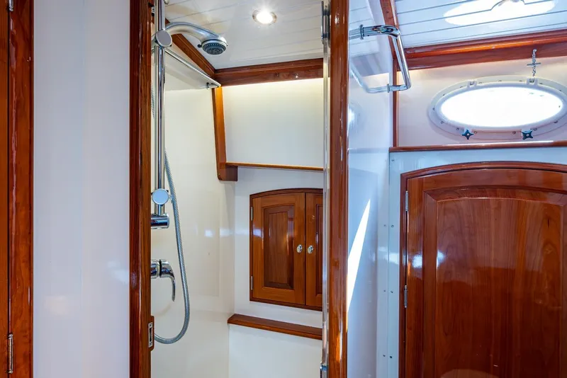 Slide: The Image of Luxurious wooden interior of 2019 Hinckley T55 MKII Motor Yacht bathroom with shower. - 29