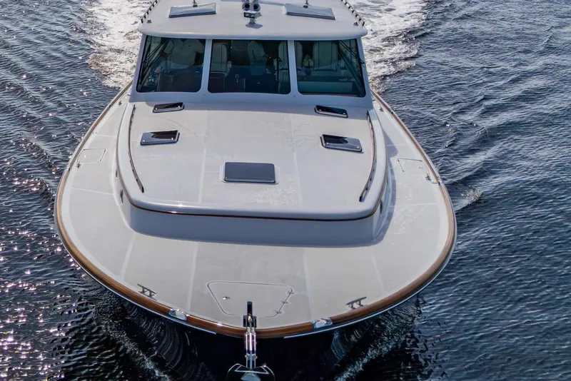 Slide: The Image of 2019 Hinckley T55 MKII Motor Yacht cruising on open water. - 3