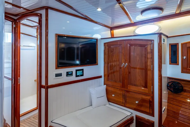 Slide: The Image of Luxurious interior of 2019 Hinckley T55 MKII Motor Yacht with wood finishes and modern amenities. - 32