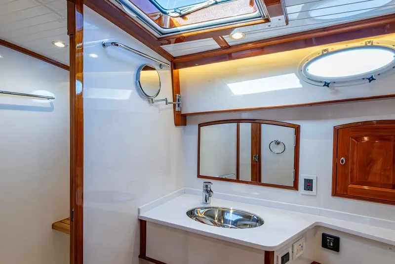 Slide: The Image of Luxurious bathroom interior of 2019 Hinckley T55 MKII Motor Yacht with wood accents. - 44