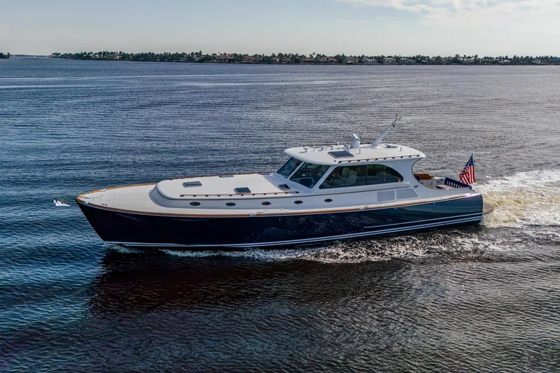 Slide: The Image of 2019 Hinckley T55 MKII Motor Yacht cruising on open water, displaying sleek design and elegance. - 53