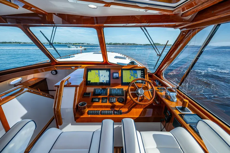 Slide: The Image of Luxurious 2019 Hinckley T55 MKII Motor Yacht cockpit with navigation screens and ocean view. - 18