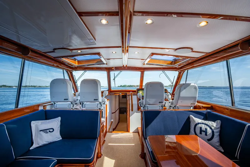 Slide: The Image of Luxurious interior of 2019 Hinckley T55 MKII Motor Yacht with plush seating and panoramic windows. - 19