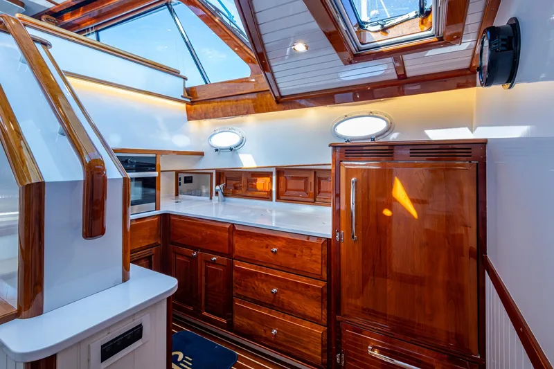 Slide: The Image of Luxurious interior of 2019 Hinckley T55 MKII Motor Yacht with elegant wood finishes. - 21