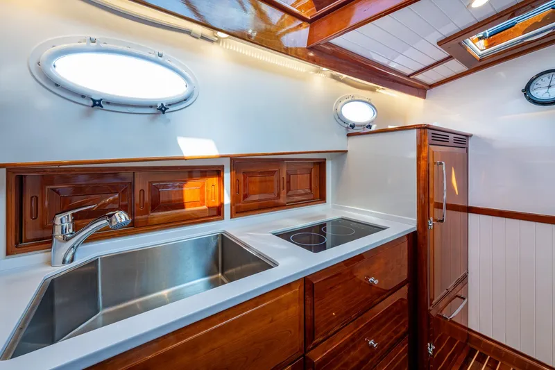 Slide: The Image of Luxurious kitchen interior of 2019 Hinckley T55 MKII Motor Yacht with wood finish. - 24