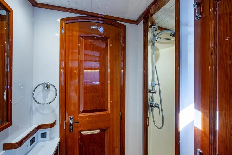 Slide: The Image of Luxurious bathroom interior of 2019 Hinckley T55 MKII Motor Yacht with wooden finishes. - 28