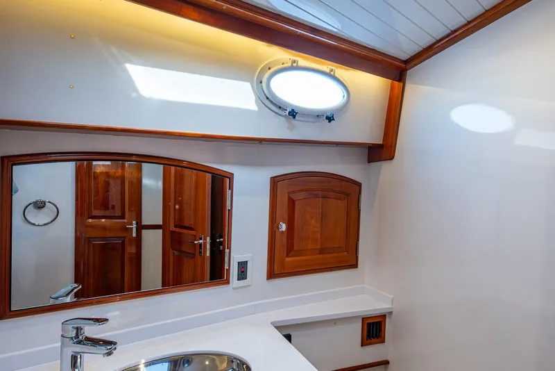 Slide: The Image of Luxurious bathroom interior of 2019 Hinckley T55 MKII Motor Yacht with wooden accents. - 35