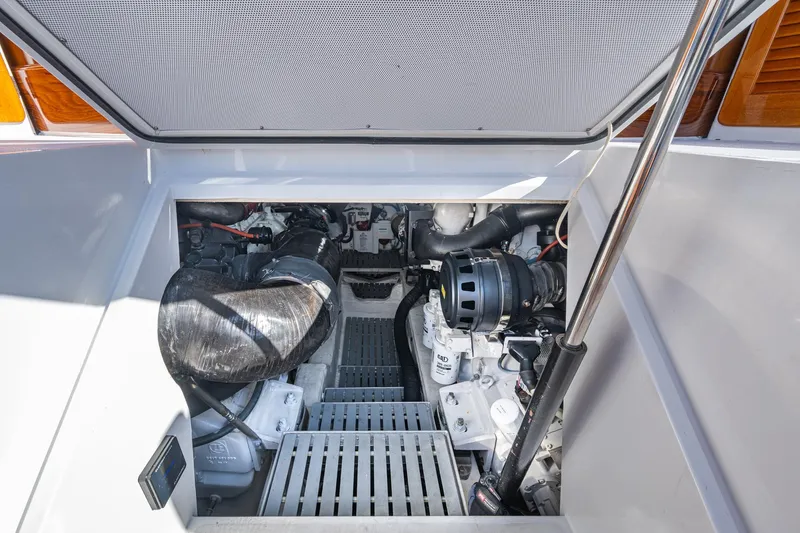 Slide: The Image of Engine compartment of 2019 Hinckley T55 MKII Motor Yacht, showcasing mechanical components. - 49
