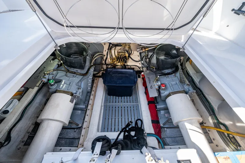 Slide: The Image of Engine room of 2019 Hinckley T55 MKII Motor Yacht, showcasing dual engines and mechanical components. - 52