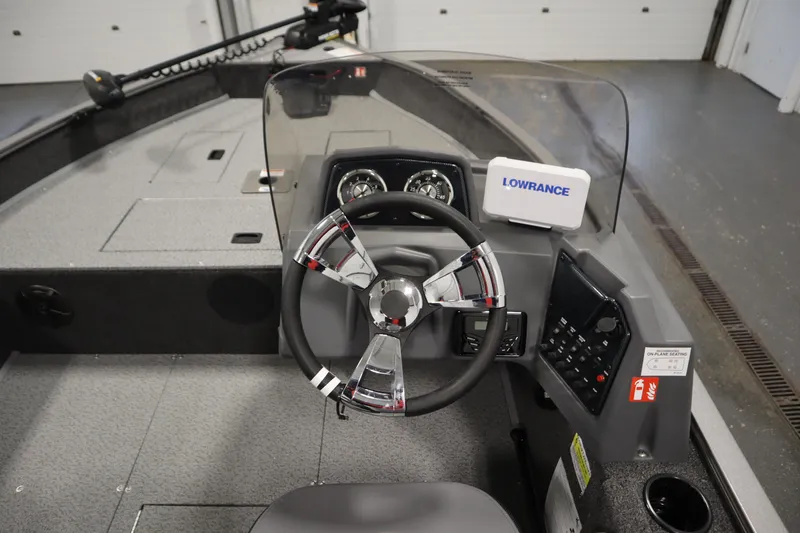 Slide: The Image of 2026 Lowe Fishing Machine 1625SC boat deck with storage compartments. - 19