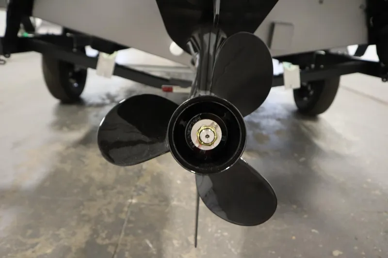 Slide: The Image of 2026 Lowe Fishing Machine 1625SC with Mercury outboard motor in a showroom. - 33