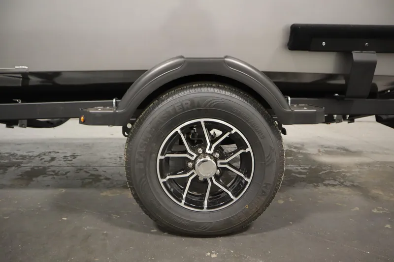 Slide: The Image of Trailer hitch and winch of 2026 Lowe Fishing Machine 1625SC on concrete floor. - 36