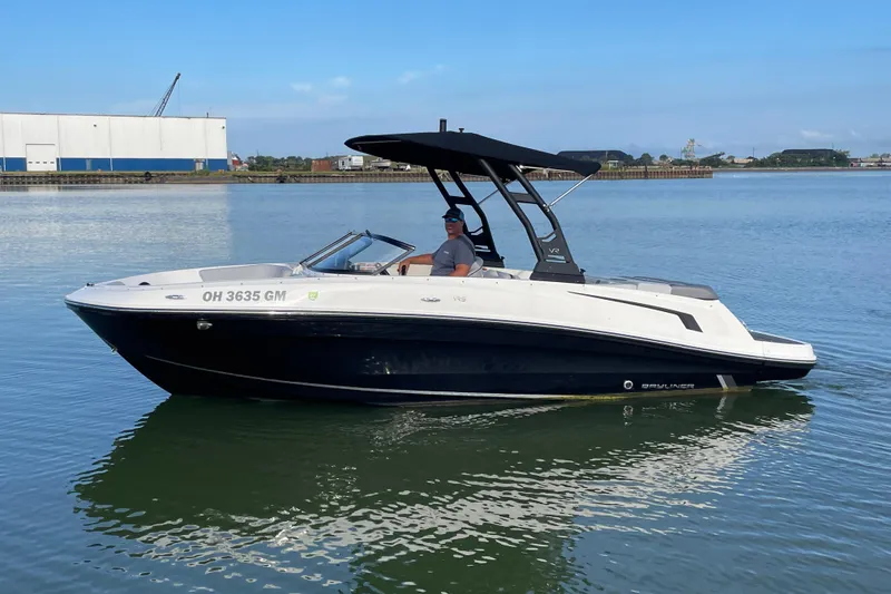 The Image of 2023 Bayliner VR5 boat on calm water, featuring sleek design and modern canopy. - 0