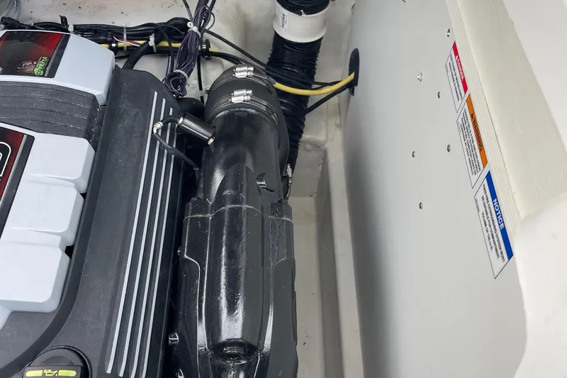 Slide: The Image of Engine compartment of 2023 Bayliner VR5 boat, showing detailed components and wiring. - 14