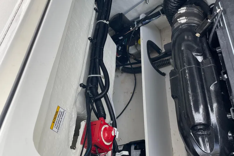 Slide: The Image of Engine compartment of a 2023 Bayliner VR5 boat, showing wiring and components. - 15