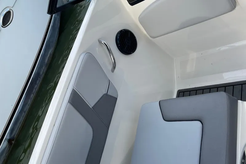 Slide: The Image of 2023 Bayliner VR5 boat interior with gray seating and sleek design. - 19