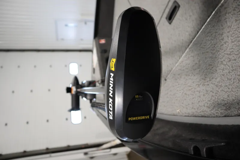 Slide: The Image of 2026 Lowe Fishing Machine 1625WT with Minn Kota PowerDrive motor in a garage. - 11