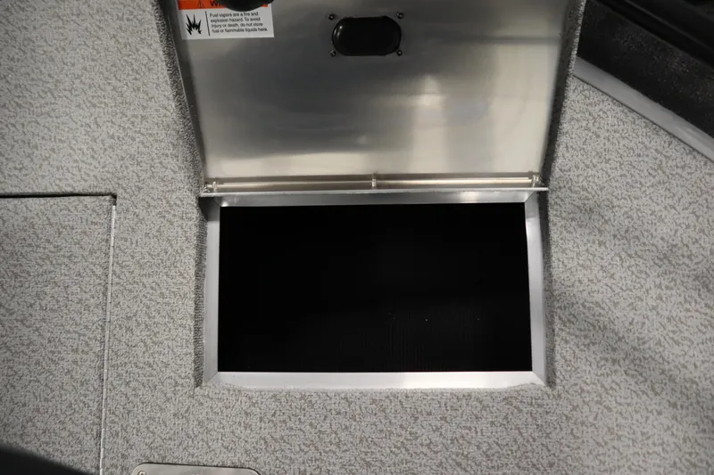 Slide: The Image of 2026 Lowe Fishing Machine 1625WT storage compartment with open hatch, showcasing interior space. - 15