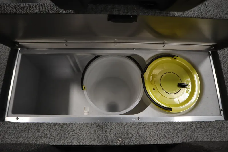 Slide: The Image of 2026 Lowe Fishing Machine 1625WT livewell with yellow lid and storage compartment. - 18