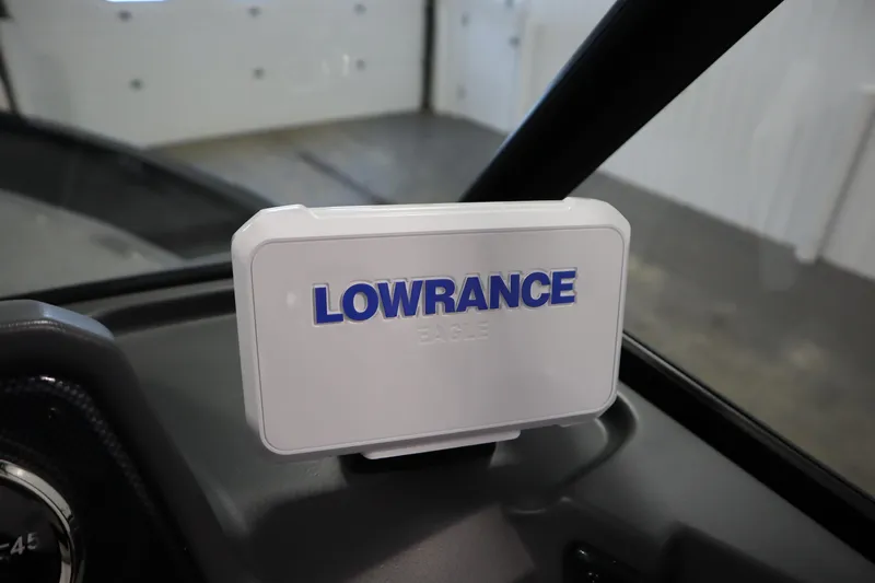 Slide: The Image of Lowrance device on 2026 Lowe Fishing Machine 1625WT dashboard in a garage setting. - 23