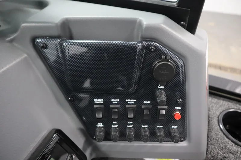 Slide: The Image of Control panel of 2026 Lowe Fishing Machine 1625WT with switches and power outlets. - 26
