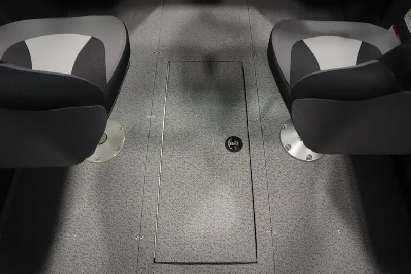 Slide: The Image of 2026 Lowe Fishing Machine 1625WT interior with two seats and storage compartment. - 29