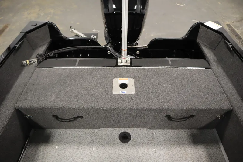 Slide: The Image of 2026 Lowe Fishing Machine 1625WT interior, featuring spacious deck and storage compartments. - 33